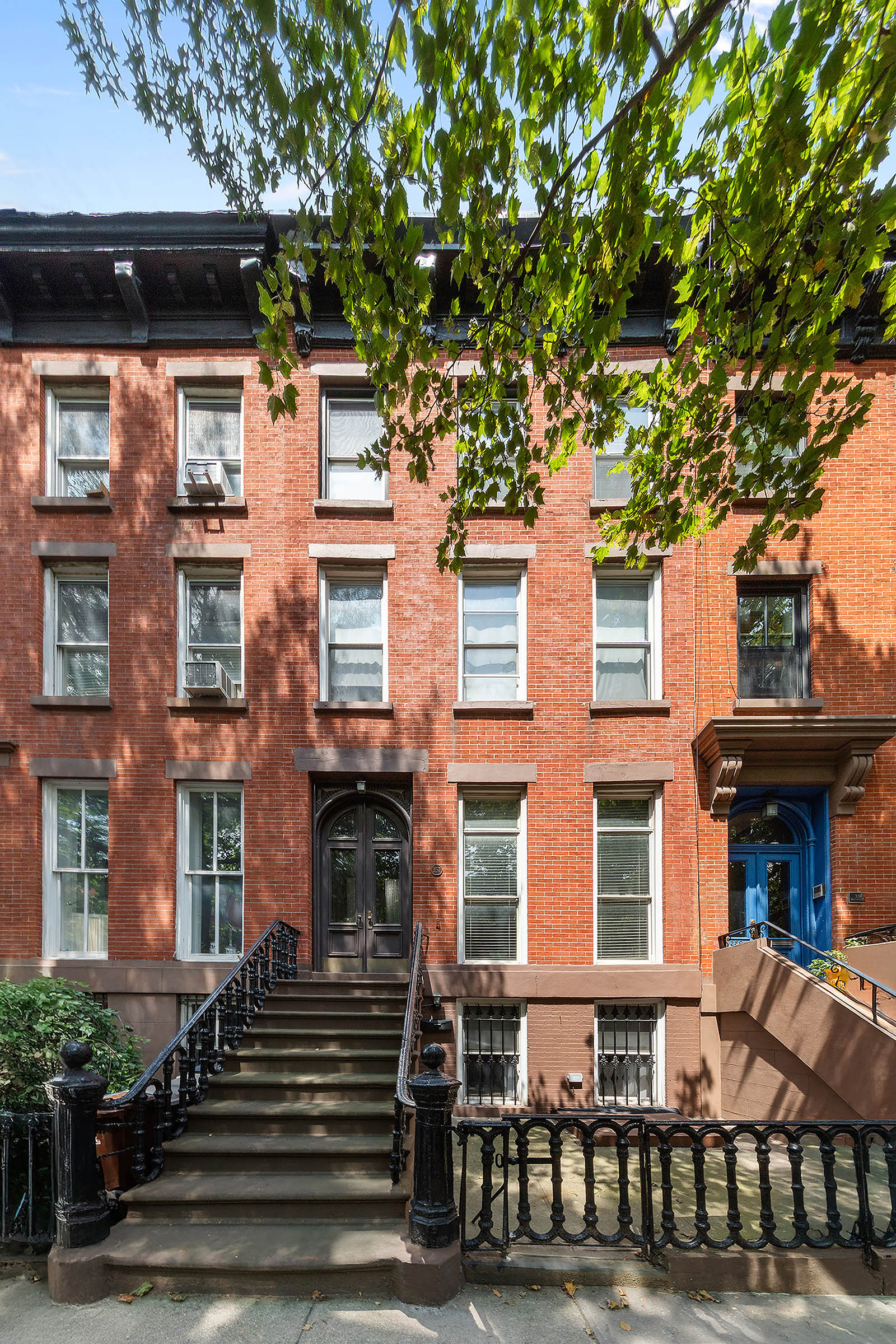 a front view of a building with a lot of windows