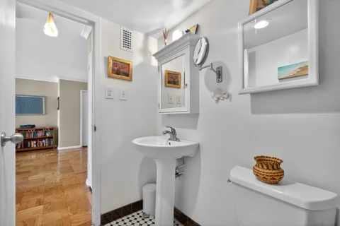a bathroom with a sink a mirror and a shower