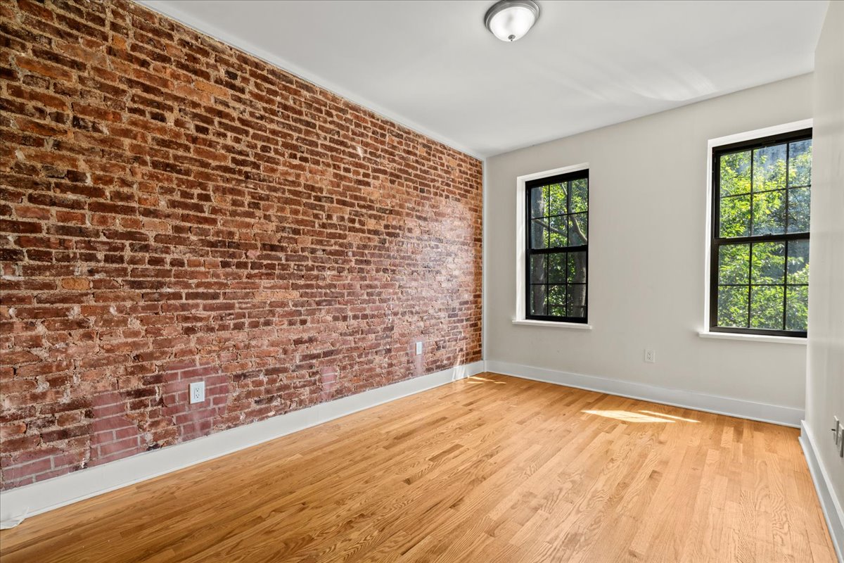 1773 Nostrand Avenue Brooklyn, NY 11226 - Photo 5 of 12 a view of an empty room and window