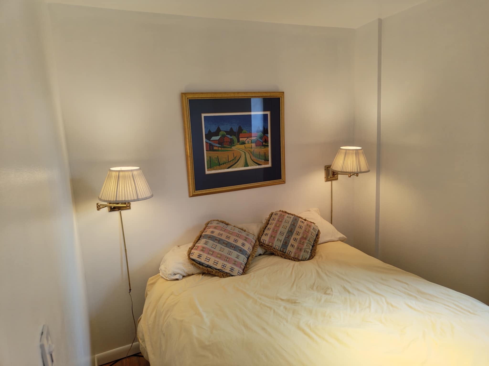 319 East 105th Street, Unit 5A Manhattan, NY 10029 - Photo 7 of 13 a bedroom with a bed and a lamp