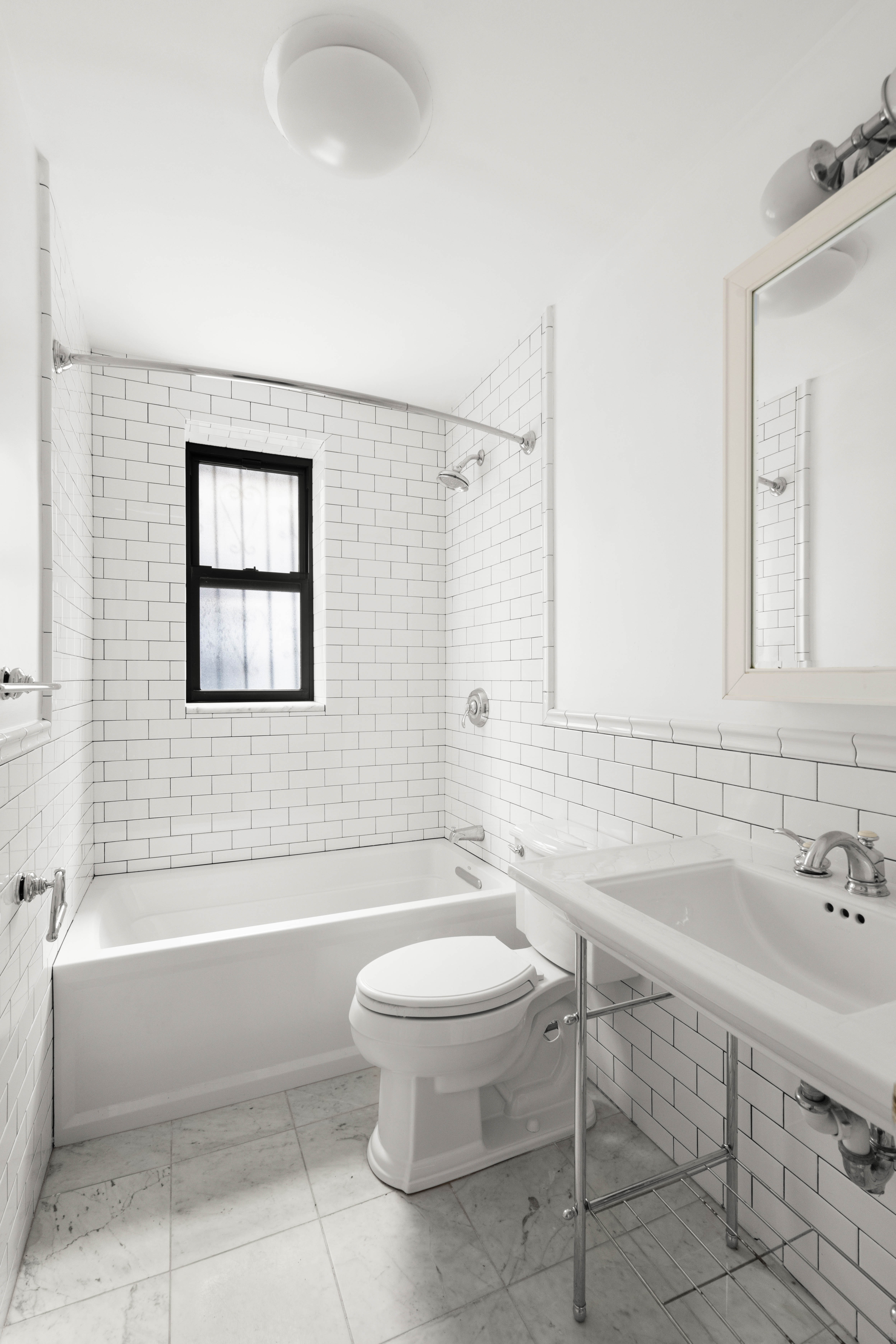 436 Sterling Place, Unit 10 Brooklyn, NY 11238 - Photo 5 of 6 a bathroom with a sink toilet and shower