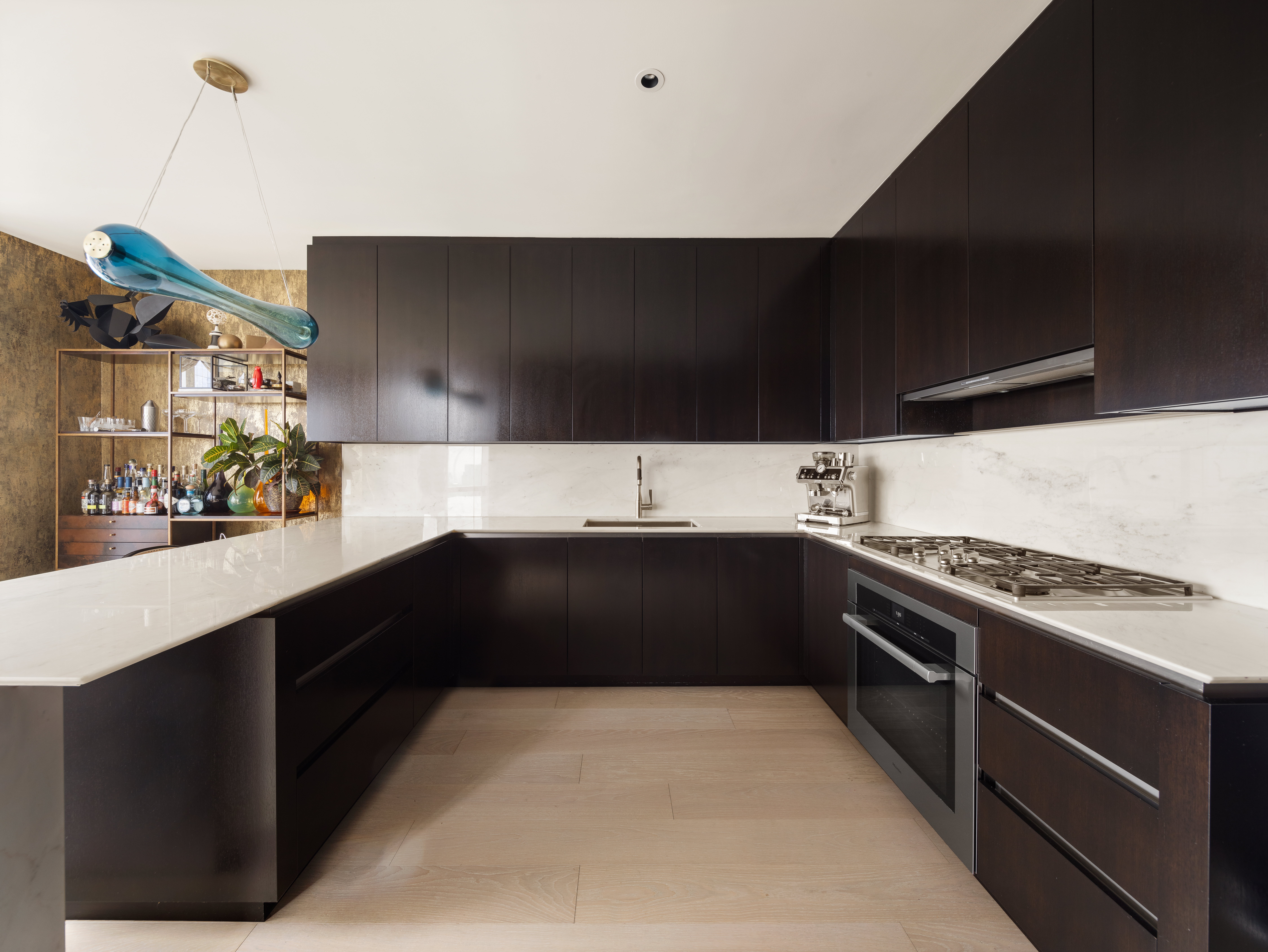 15 Hudson Yards, Unit PH83D Manhattan, NY 10001 - Photo 4 of 20 a kitchen with stainless steel appliances a stove and a refrigerator