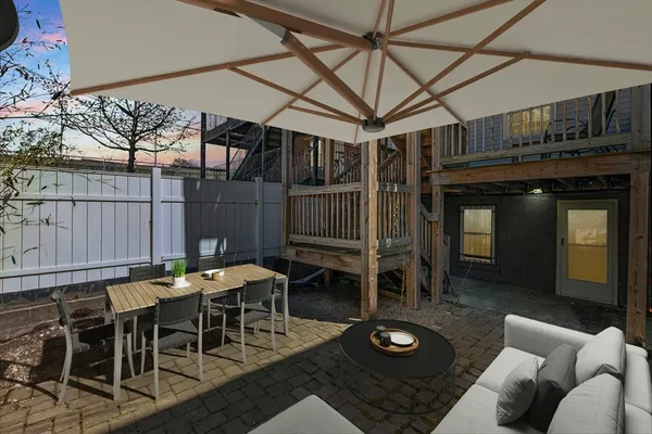 a dinning table and chairs in a patio