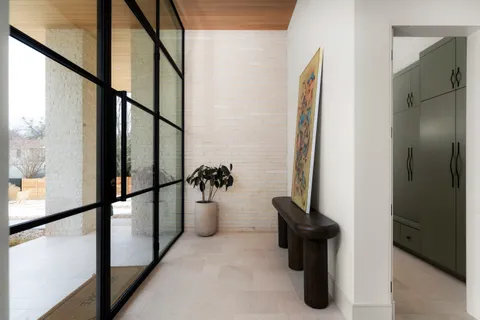 a living room with furniture potted plant and a fireplace