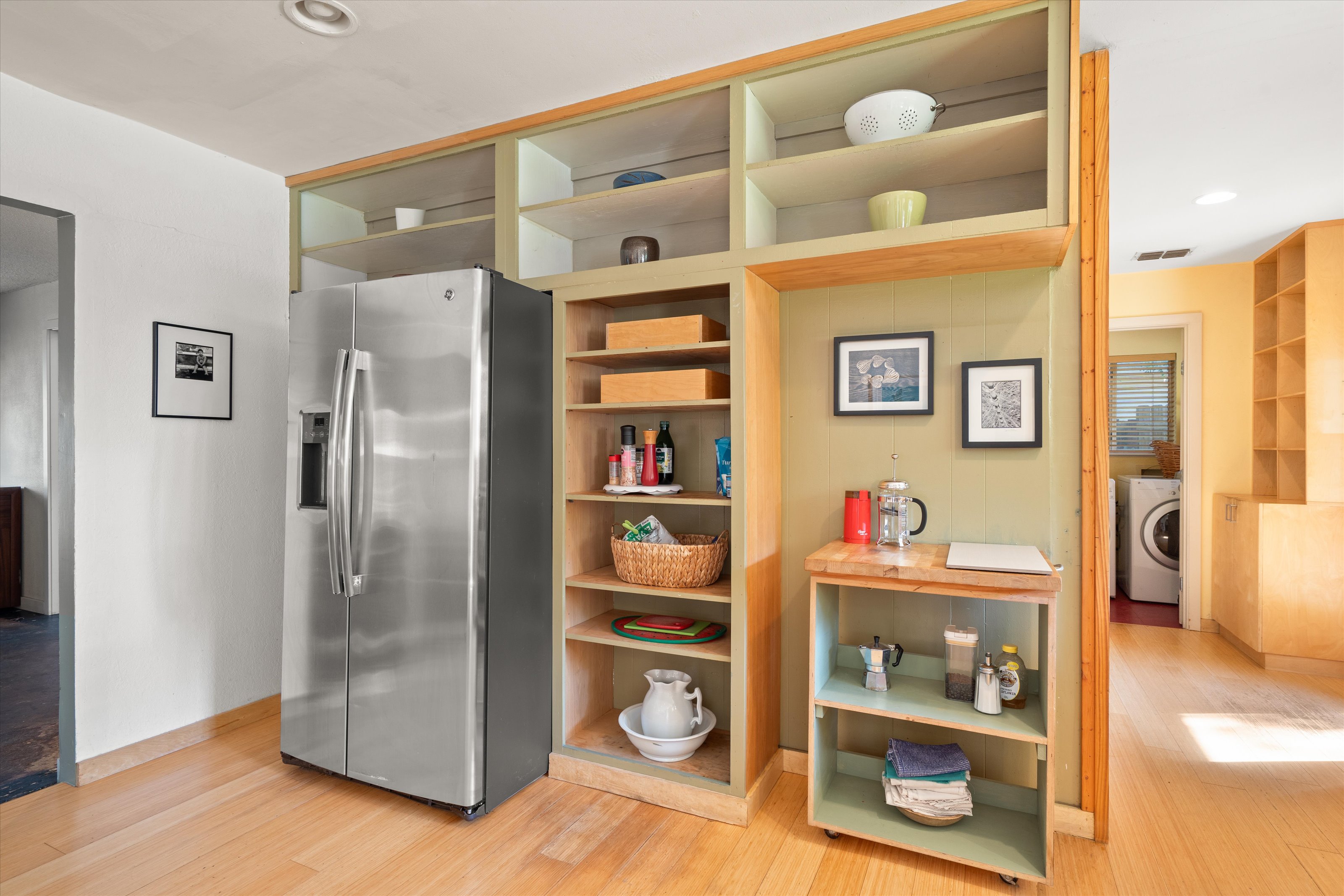 4614 Jinx Avenue Austin, TX 78745 - Photo 5 of 40 a kitchen with stainless steel appliances a refrigerator and cabinets