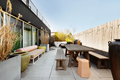 a outdoor dining space with furniture and outdoor view