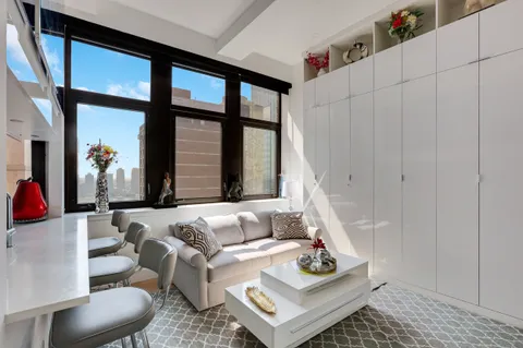 a living room with furniture and a window