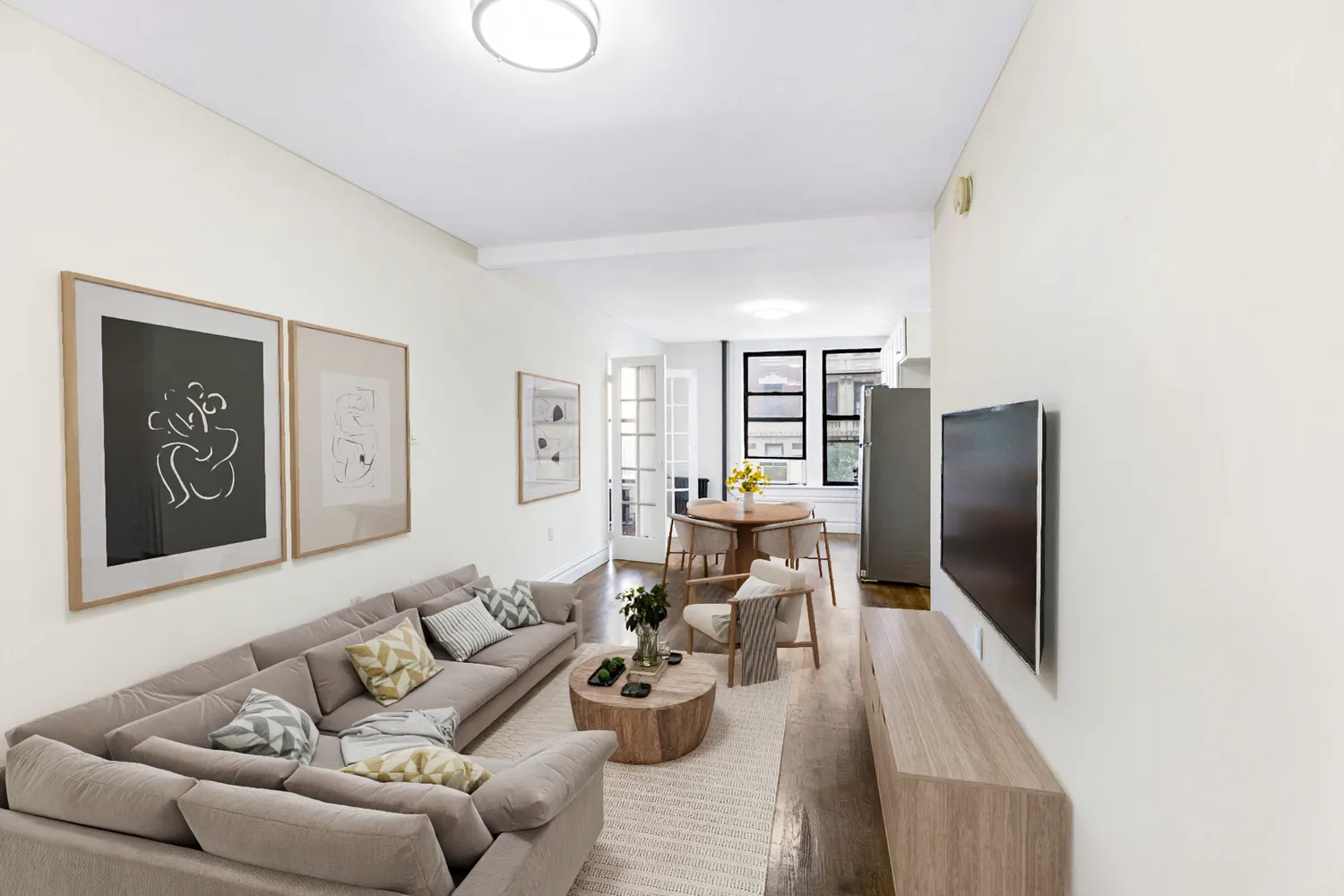a living room with furniture and a flat screen tv
