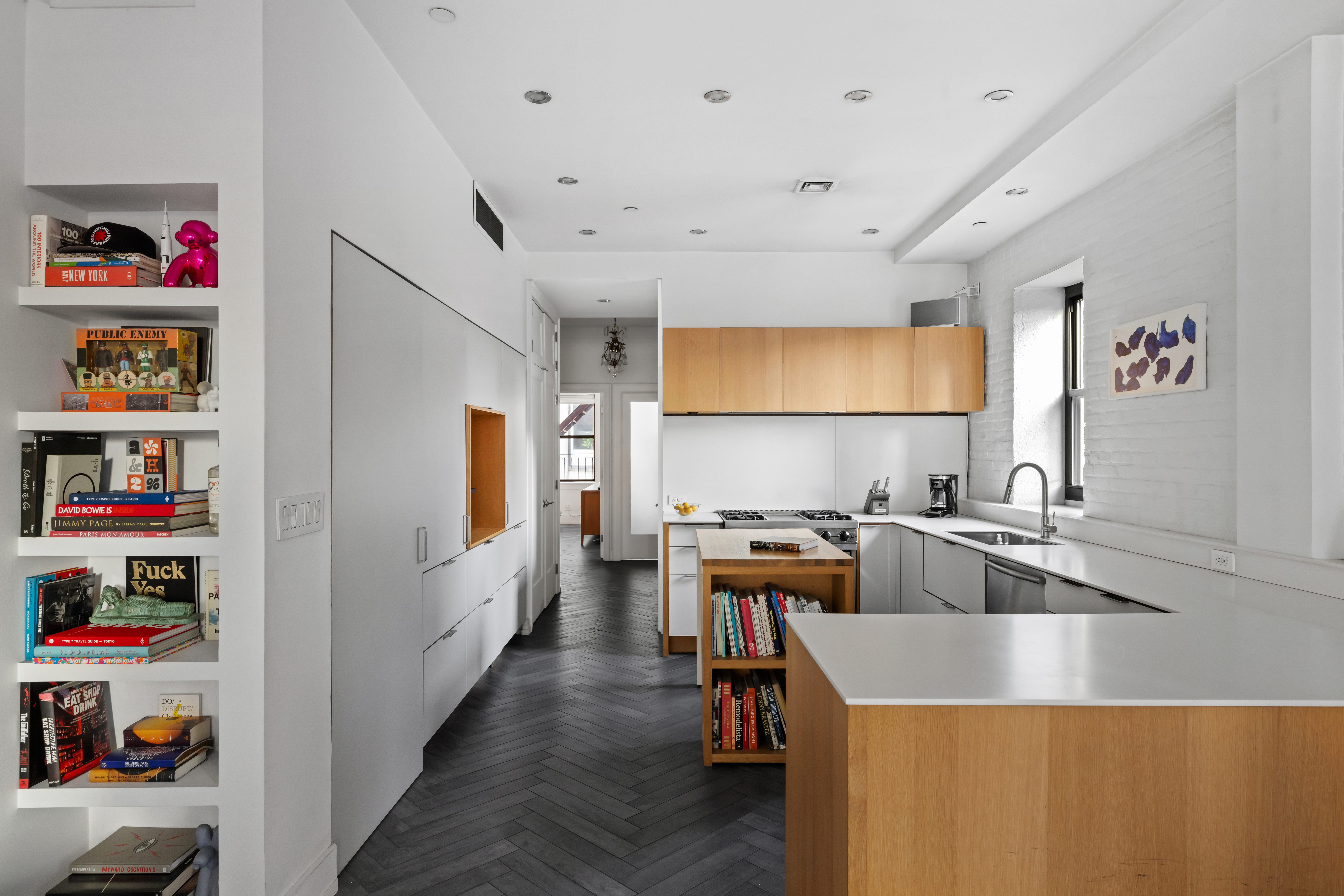 344 Bowery, Unit 3 Manhattan, NY 10012 - Photo 6 of 9 a kitchen that has a lot of cabinets a sink and a stove in it