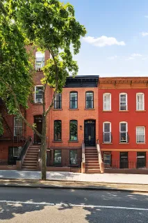a view of a building with a tree