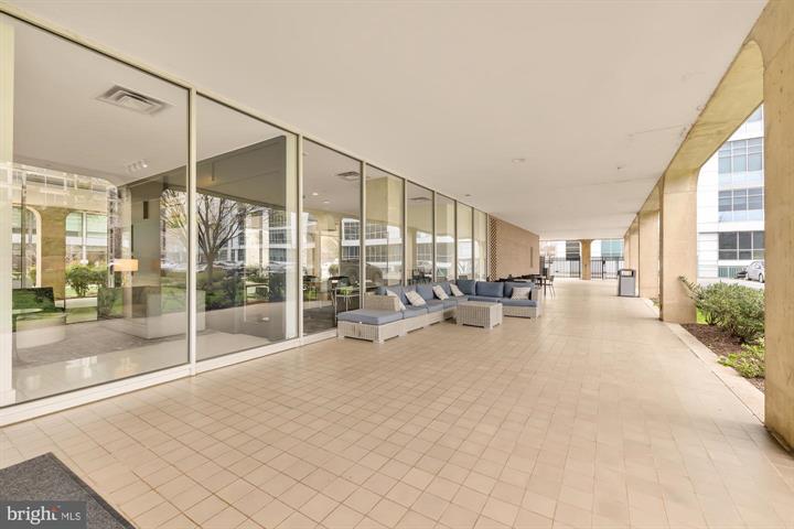 1101 3rd Street Southwest, Unit 206 Washington, DC 20024 - Photo 4 of 21 a view of a livingroom with furniture and floor to ceiling window