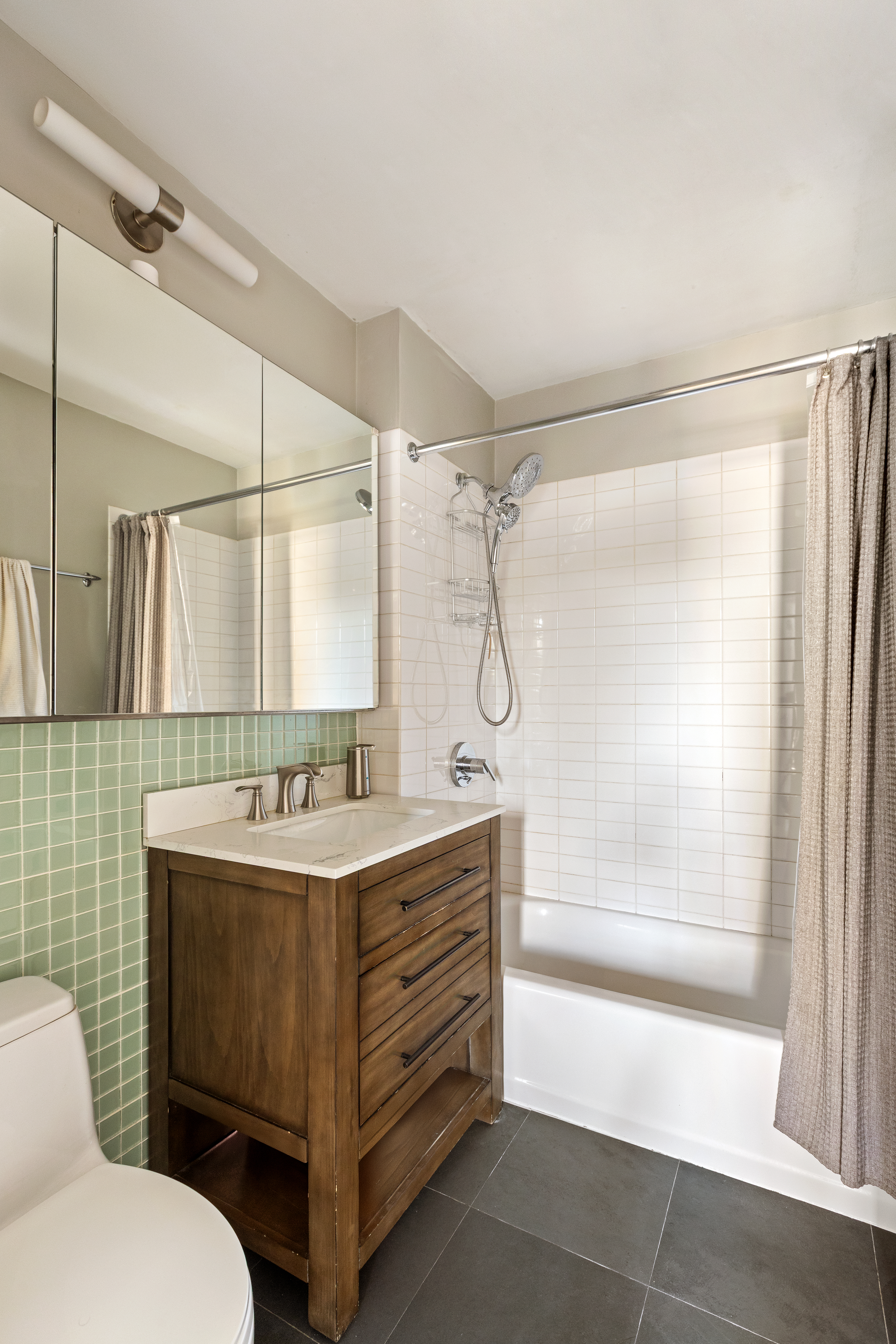 524 St Johns Place, Unit 2A Brooklyn, NY 11238 - Photo 6 of 8 a bathroom with a sink toilet and shower
