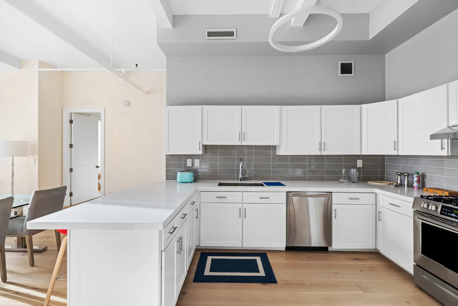 a kitchen that has a sink and a stove in it