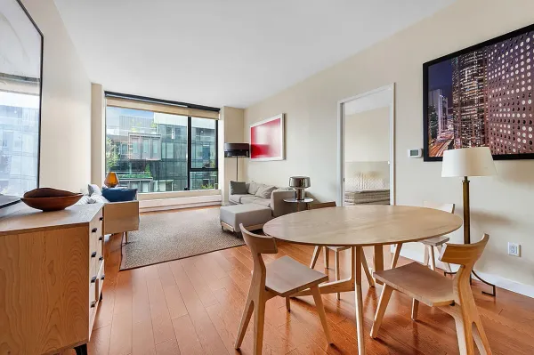 a dining room with furniture and window