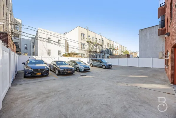 a view of a cars parked in front of a building