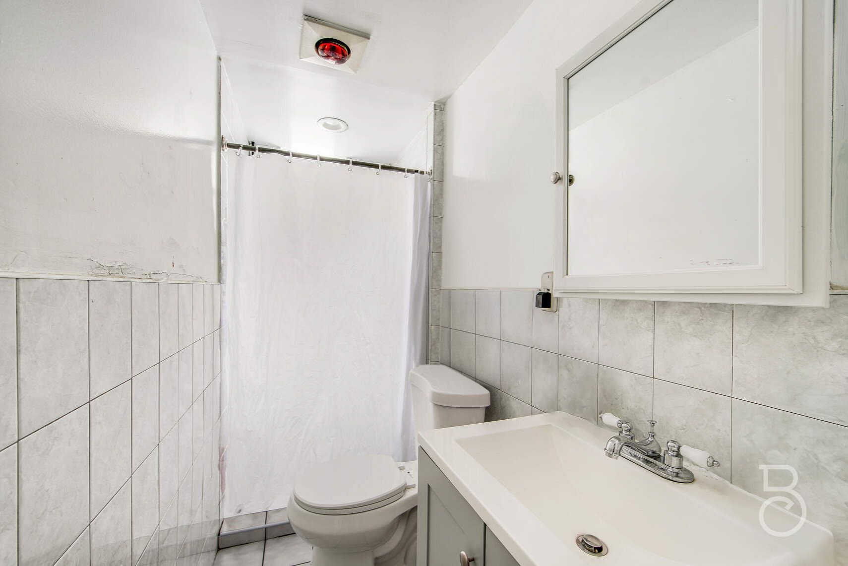 46-10 28th Avenue Queens, NY 11103 - Photo 16 of 16 a bathroom with a sink and toilet
