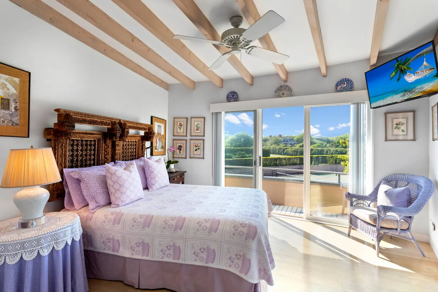 a bedroom with a bed and glass walk in closet