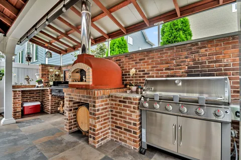 a front view of house with deck and seating space