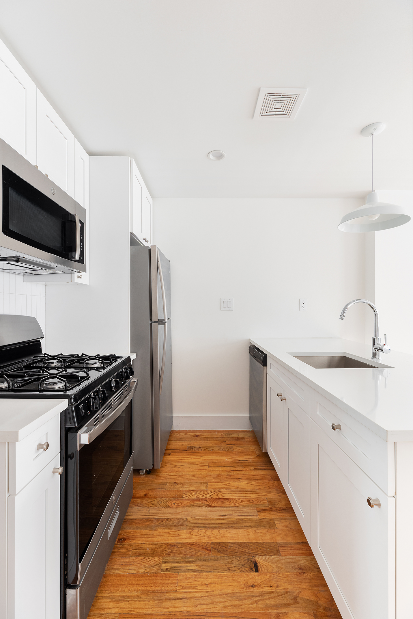59 Irving Place, Unit 1 Brooklyn, NY 11238 - Photo 2 of 6 a kitchen with granite countertop a stove and a sink