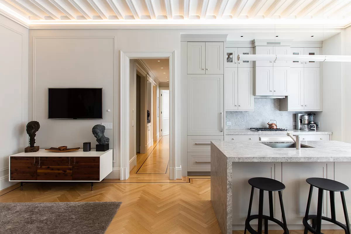 390 West End Avenue, Unit 7DS Manhattan, NY 10024 - Photo 5 of 31 a view of kitchen with kitchen island a sink wooden floor and black appliances
