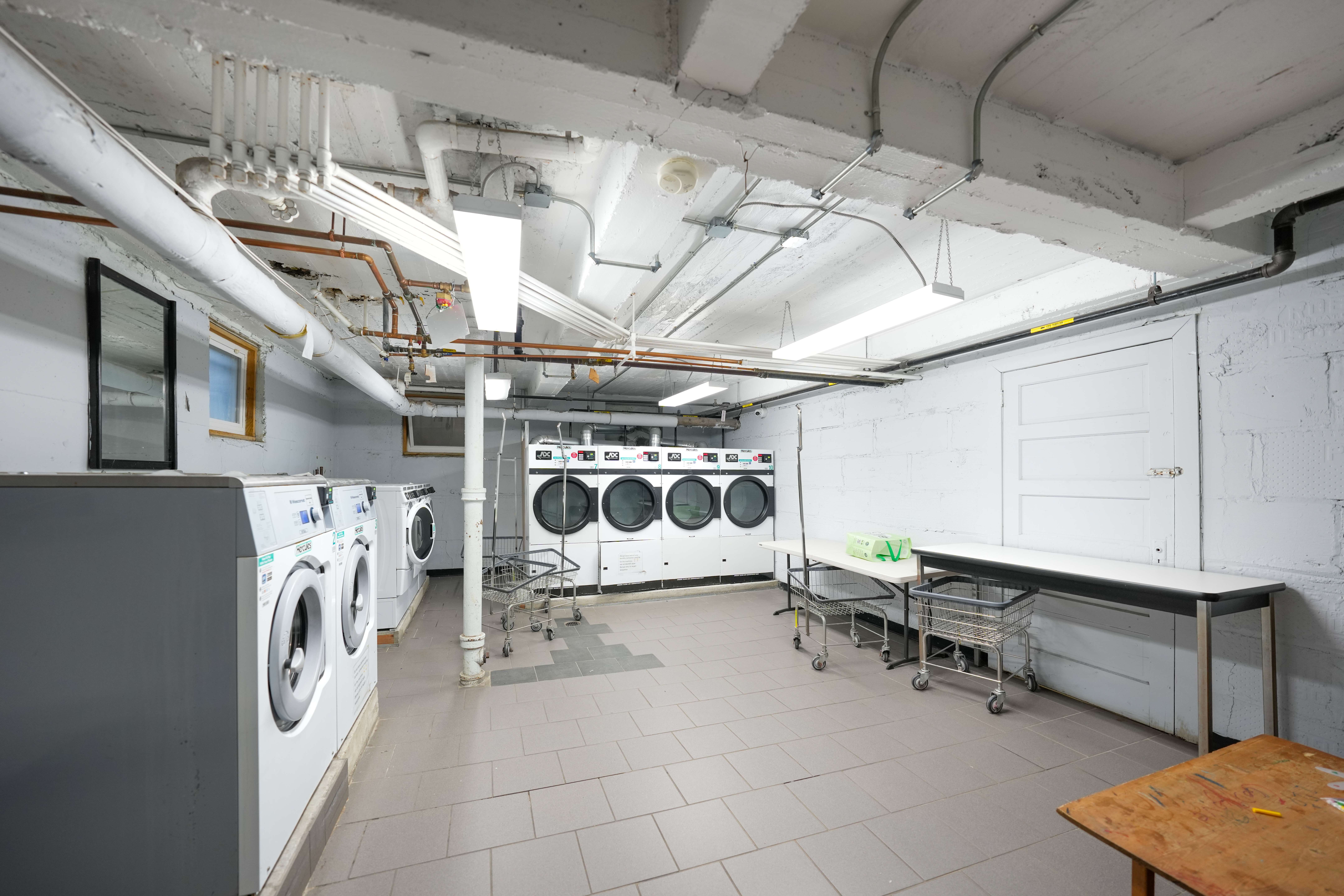 80 Avenue P, Unit D14 Brooklyn, NY 11204 - Photo 16 of 19 a utility room with dryer and washer