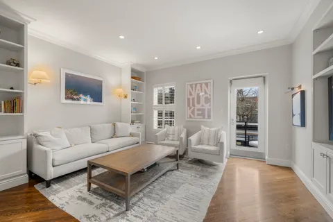 a living room with furniture and a rug
