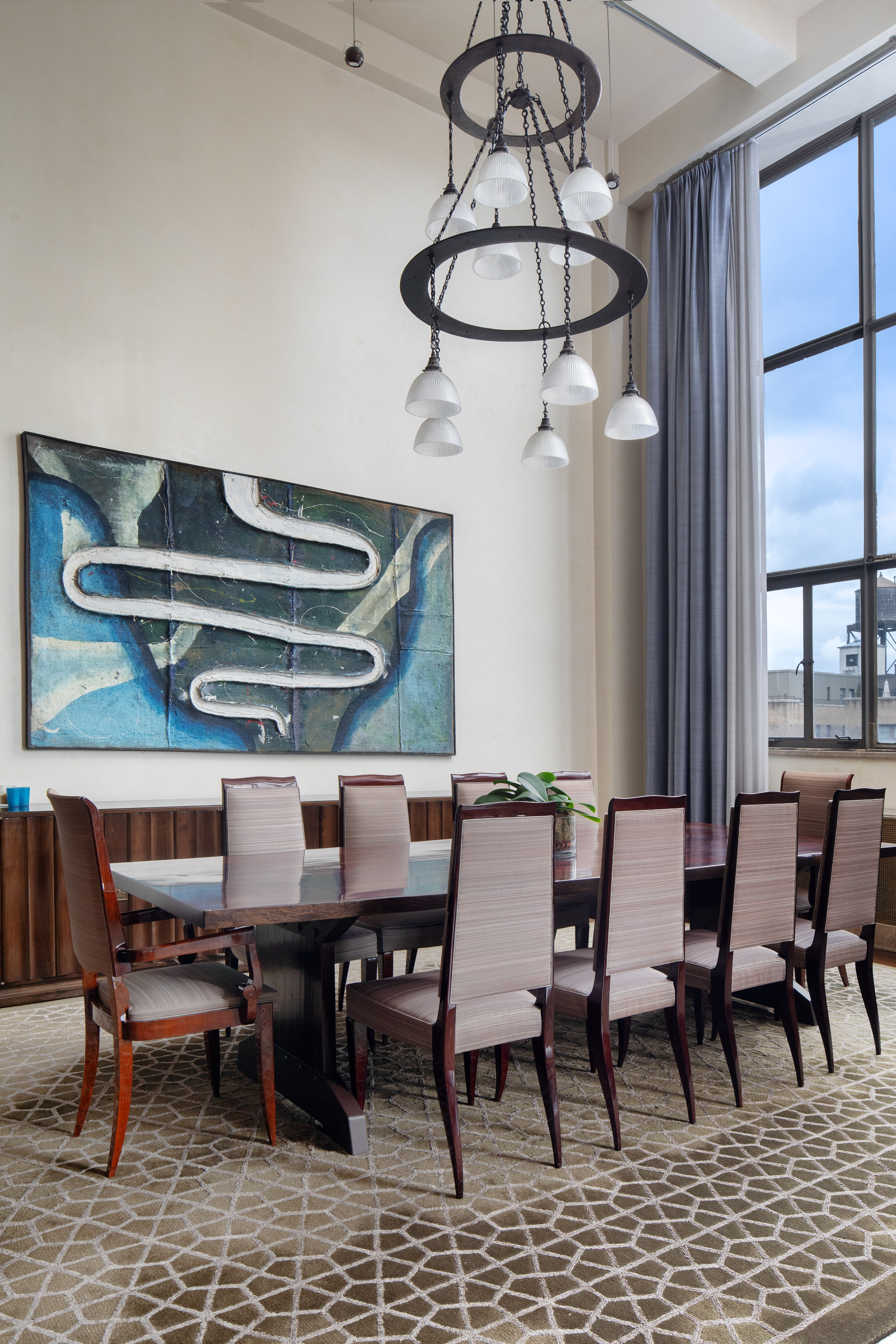 1 West 67th Street, Unit 606607 Manhattan, NY 10023 - Photo 8 of 15 a view of a dining room with furniture window and wooden floor