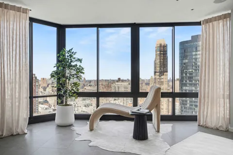 a kitchen with stainless steel appliances granite countertop a sink and a refrigerator