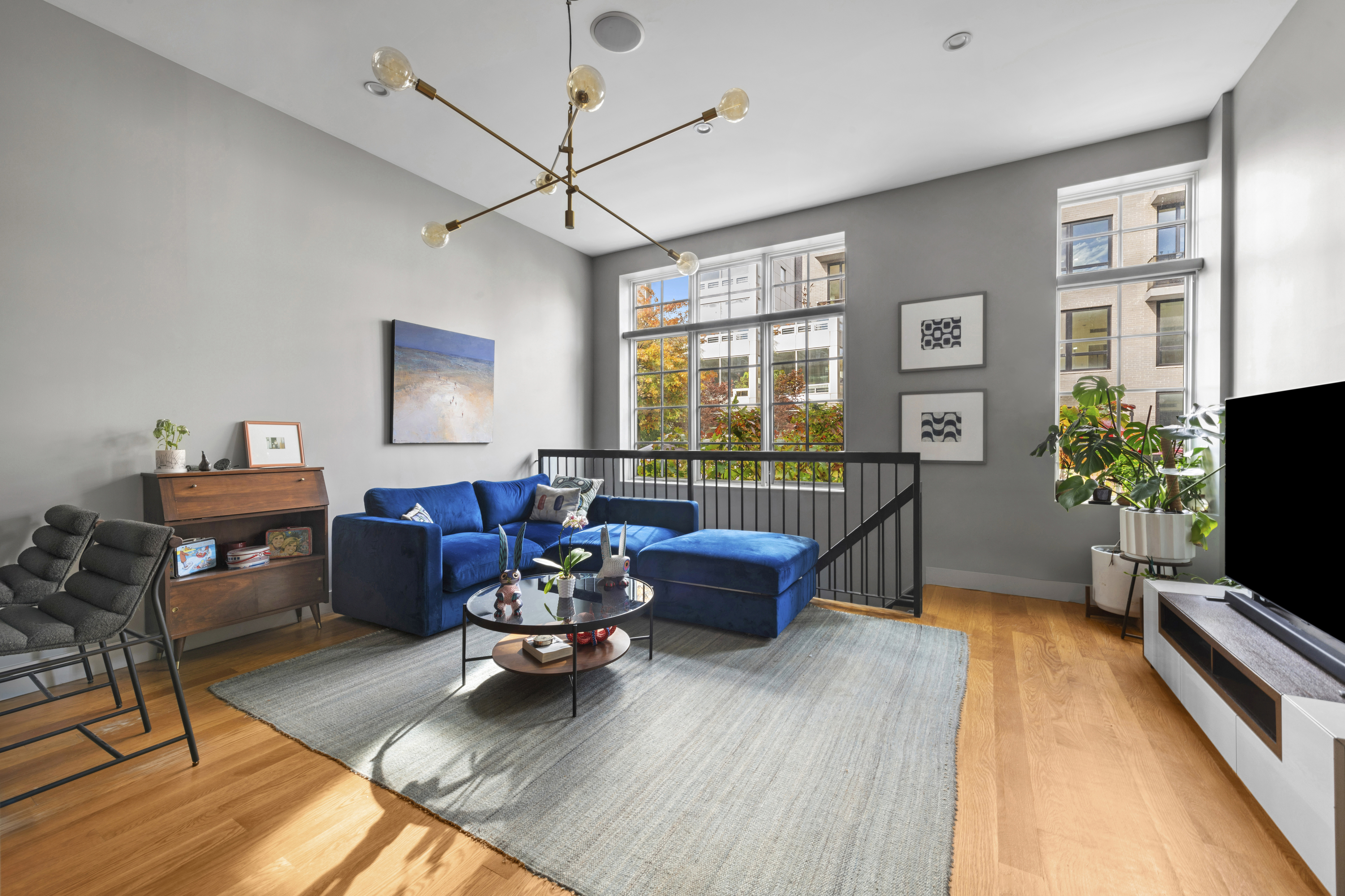 222 Withers Street, Unit 1A Brooklyn, NY 11211 - Photo 2 of 15 a living room with furniture and a flat screen tv