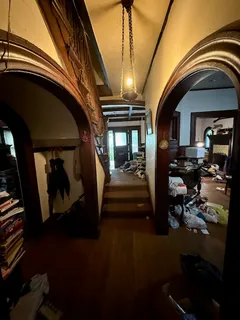 a view of hall way with furniture