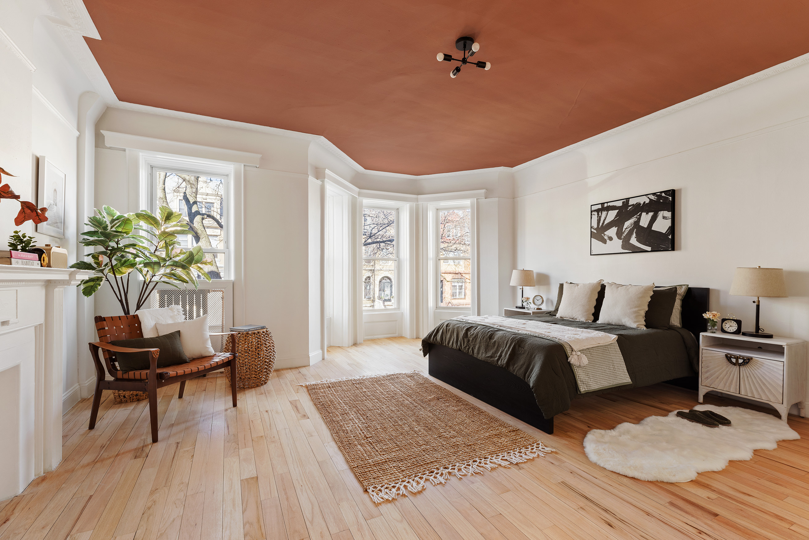 259 New York Avenue Brooklyn, NY 11216 - Photo 14 of 25 a spacious bedroom with a bed and a workspace