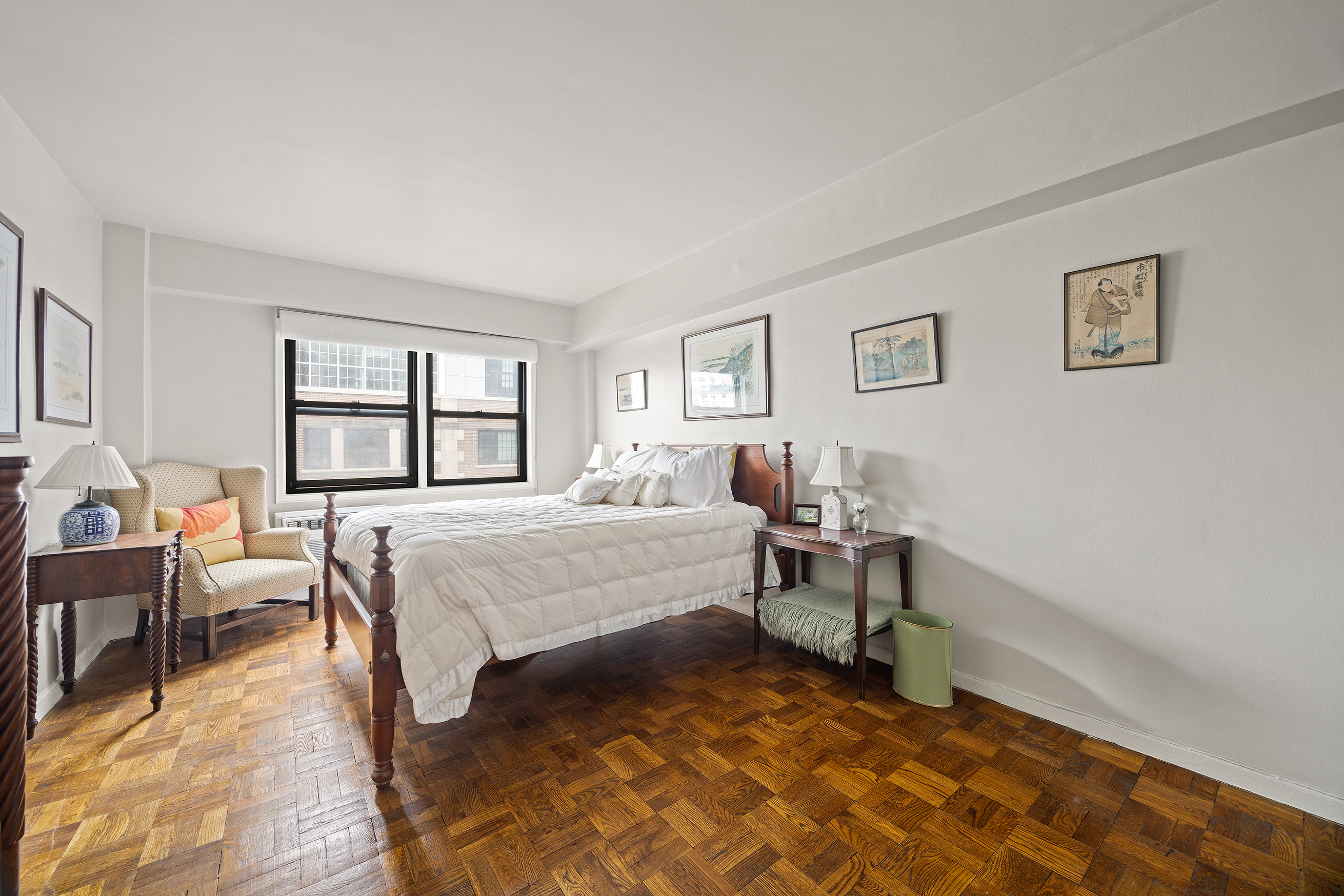 205 East 77th Street, Unit 11B Manhattan, NY 10075 - Photo 8 of 11 a bedroom with a bed and a window