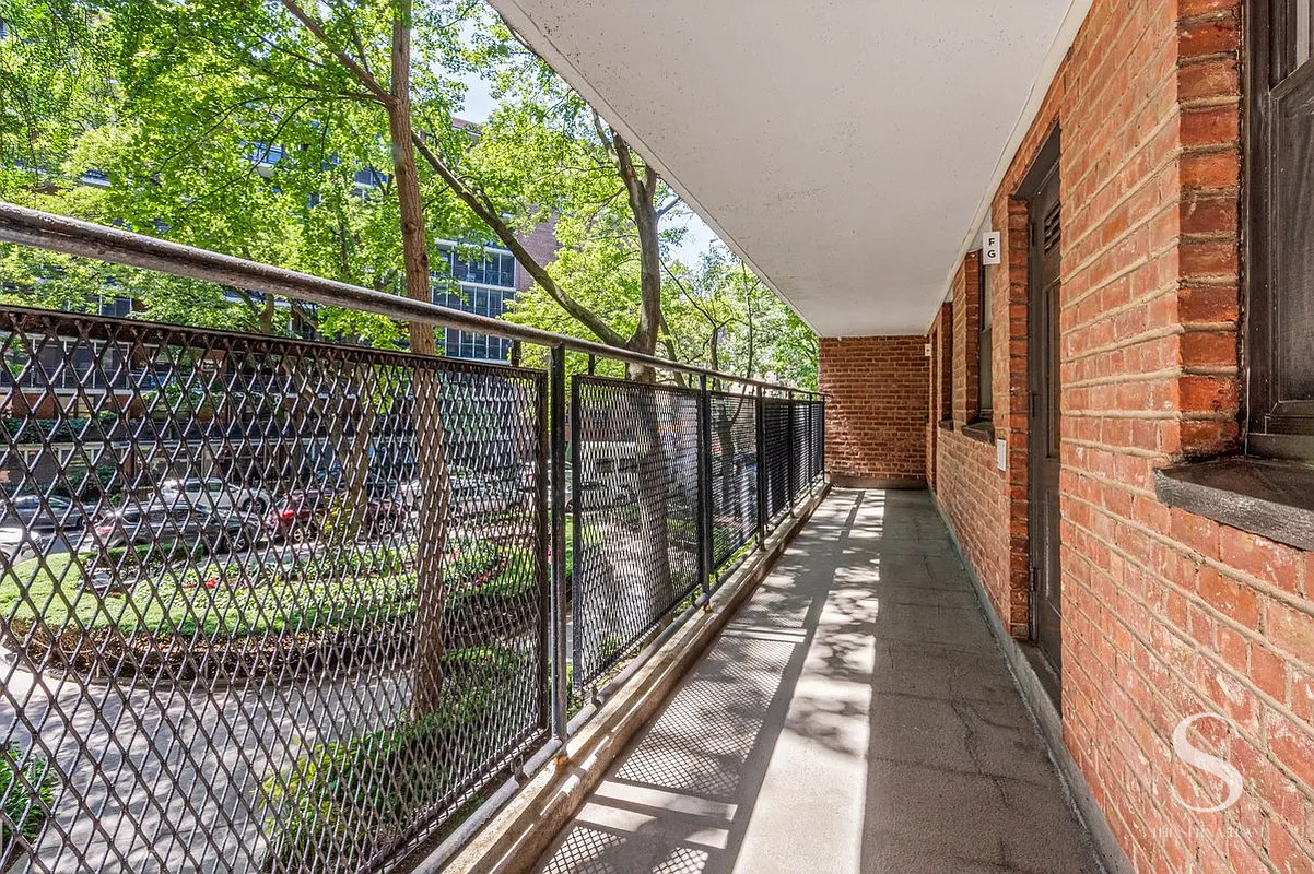 35-51 85th Street, Unit 4F Queens, NY 11372 - Photo 11 of 13 a view of balcony with wooden floor