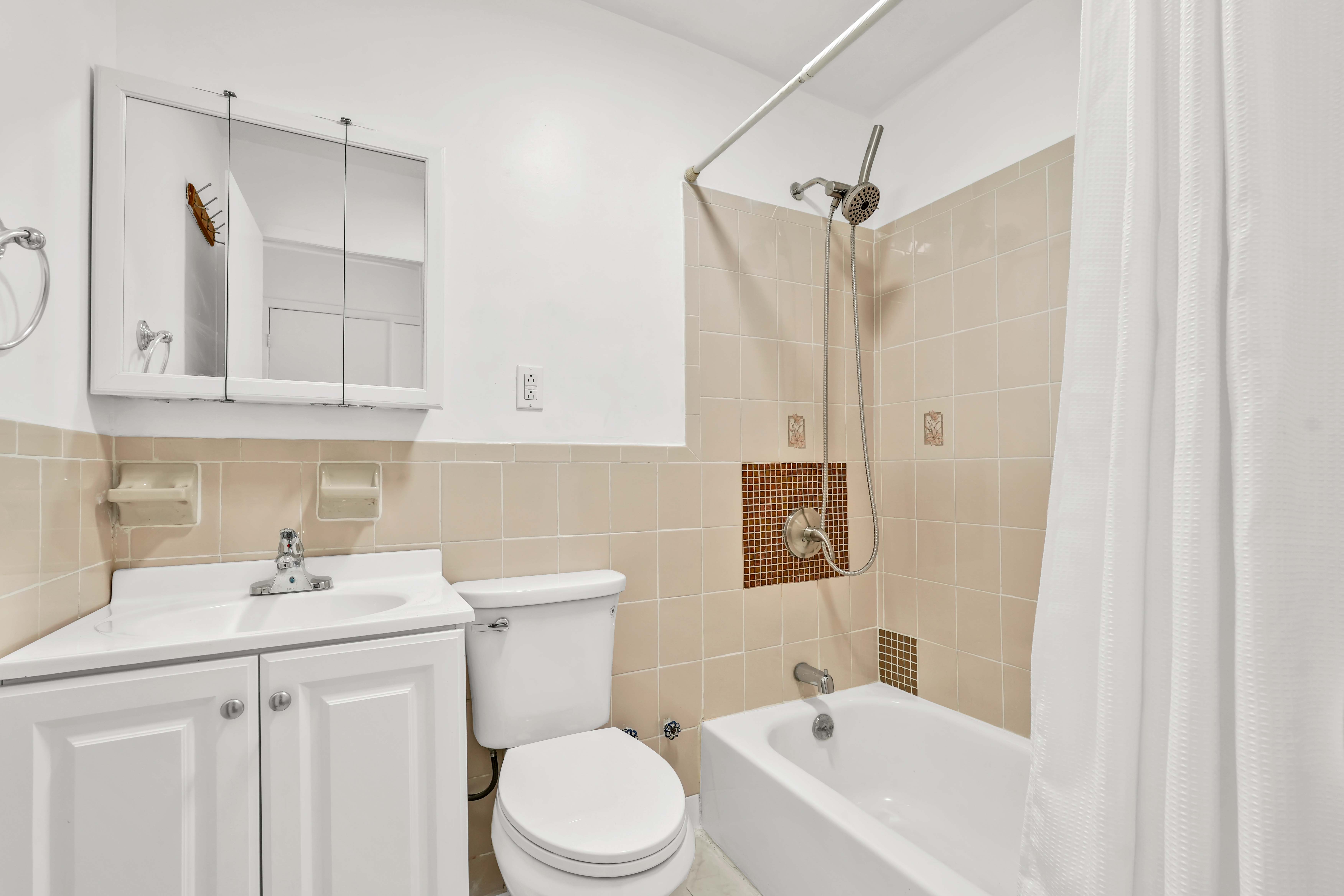 238 Vernon Avenue, Unit 2 Brooklyn, NY 11206 - Photo 16 of 21 a bathroom with a sink a toilet and shower