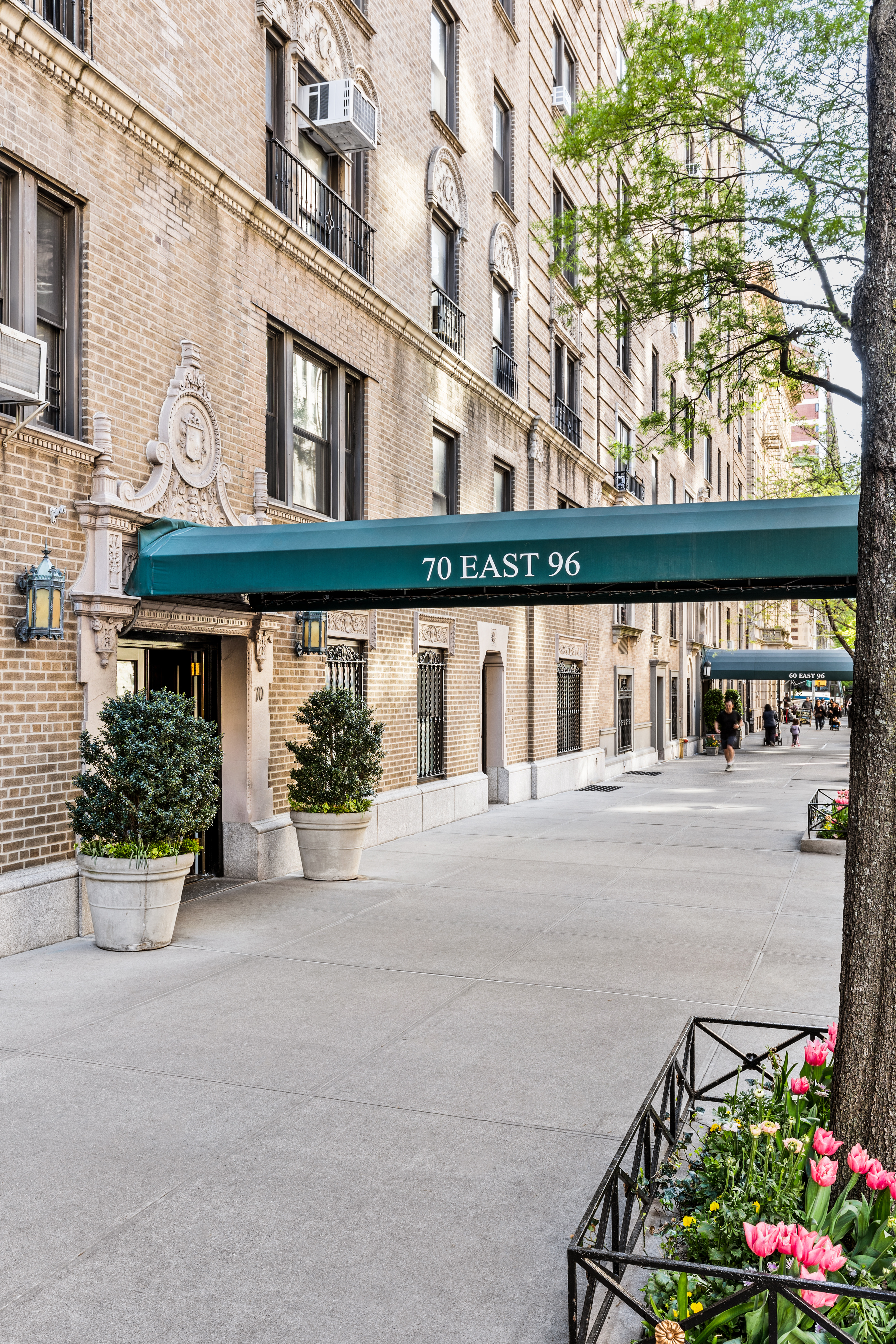 70 East 96th Street, Unit 2D Manhattan, NY 10128 - Photo 10 of 14 front view of a building with a street
