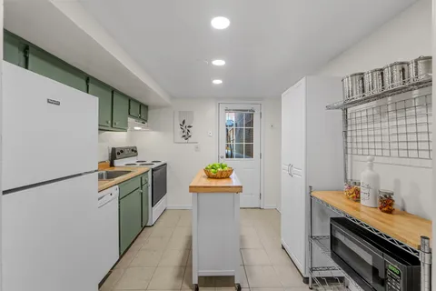 a bedroom with a bed and a mirror