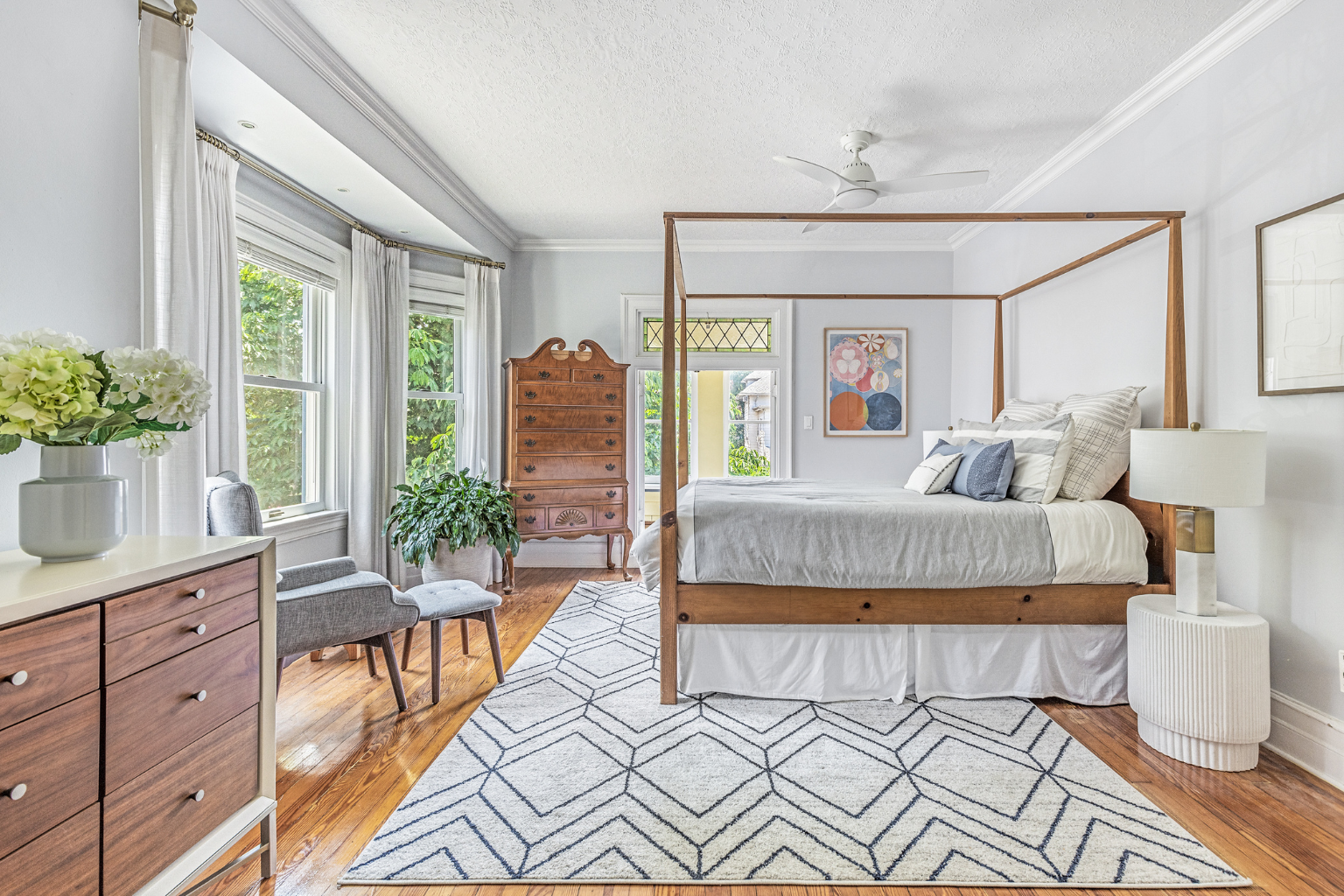 215 Marlborough Road Brooklyn, NY 11226 - Photo 10 of 21 a bedroom with a large bed and a chandelier