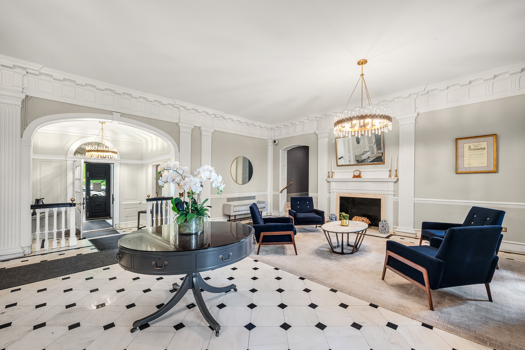 68-10 108th Street, Unit 6D Queens, NY 11375 - Photo 9 of 15 a living room with furniture a chandelier and a fireplace