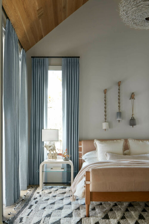 5716 Stonegate Road Dallas, TX 75209 - Photo 12 of 25 a bedroom with a bed and wooden floor