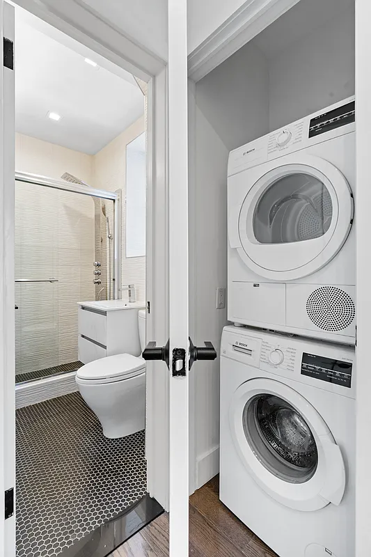 152 Thompson Street, Unit 2B Manhattan, NY 10012 - Photo 8 of 10 a utility room with sink dryer and washer