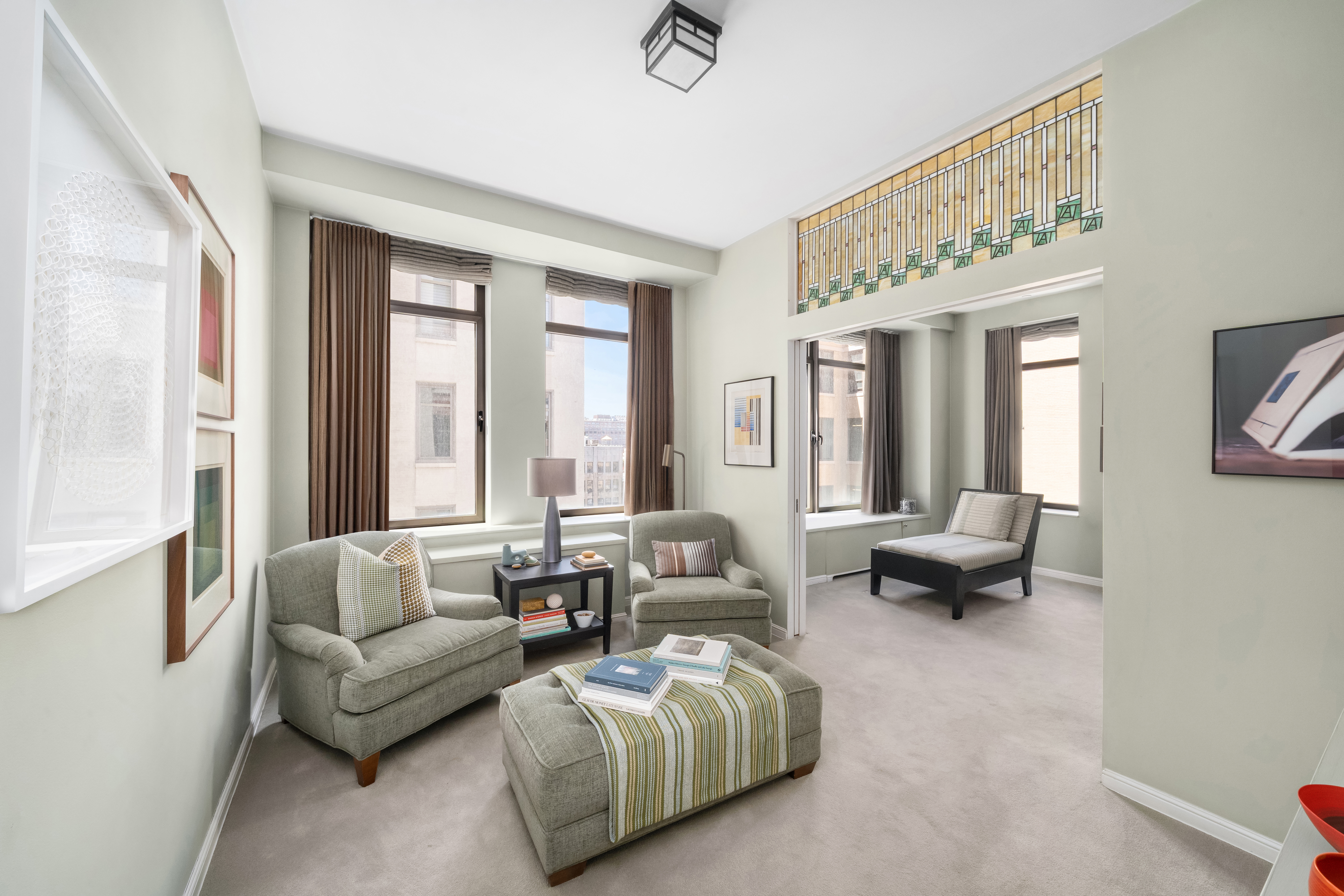 252 7th Avenue, Unit 9D Manhattan, NY 10001 - Photo 14 of 23 a living room with furniture and a large window