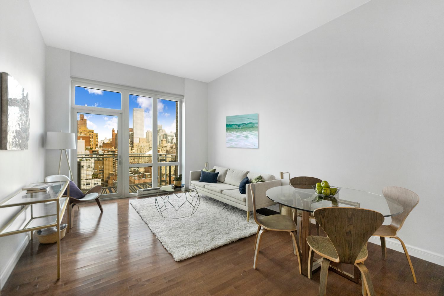 225 East 34th Street, Unit PHD Manhattan, NY 10016 - Photo 1 of 12 a living room with furniture and a large window