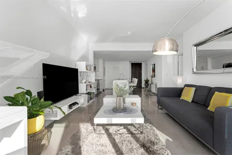 a living room with furniture fireplace and flat screen tv