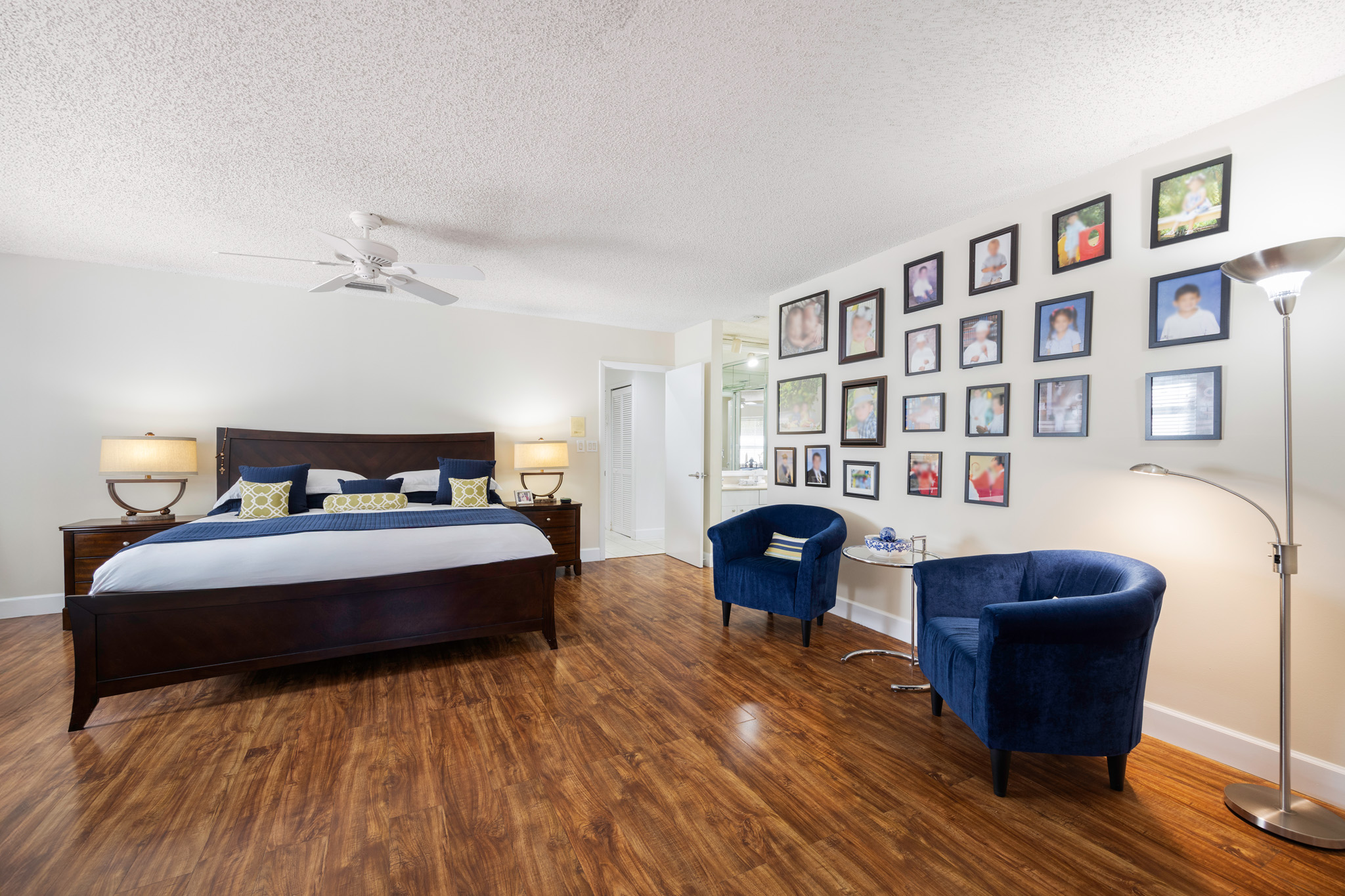 8610 Southwest 83rd Street Miami, FL 33143 - Photo 24 of 46 a spacious bedroom with a bed and a bookshelf