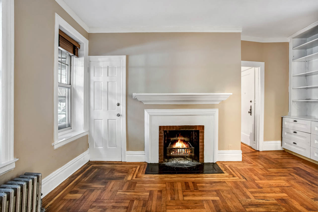 344 West 12th Street, Unit 1A Manhattan, NY 10014 - Photo 5 of 17 a living room with furniture and a fireplace