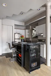 a kitchen with stainless steel appliances granite countertop a stove and a refrigerator