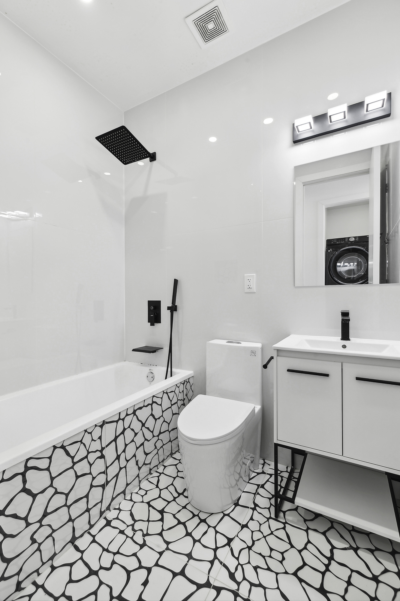 483 Hart Street, Unit 1 Brooklyn, NY 11221 - Photo 11 of 18 a bathroom with a sink toilet and a mirror