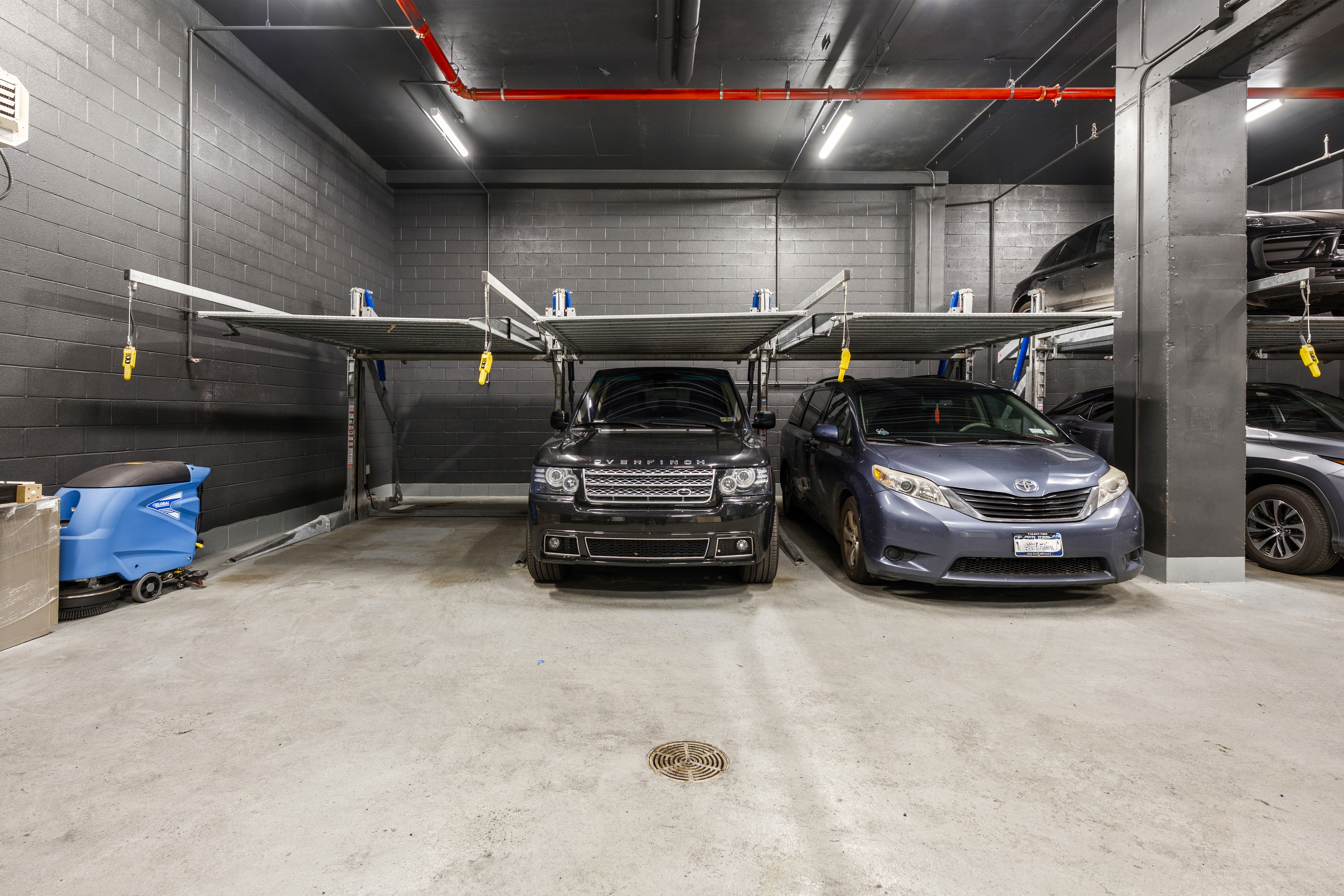 532 West 20th Street, Unit 4 Manhattan, NY 10011 - Photo 22 of 23 a view of parking garage with cars