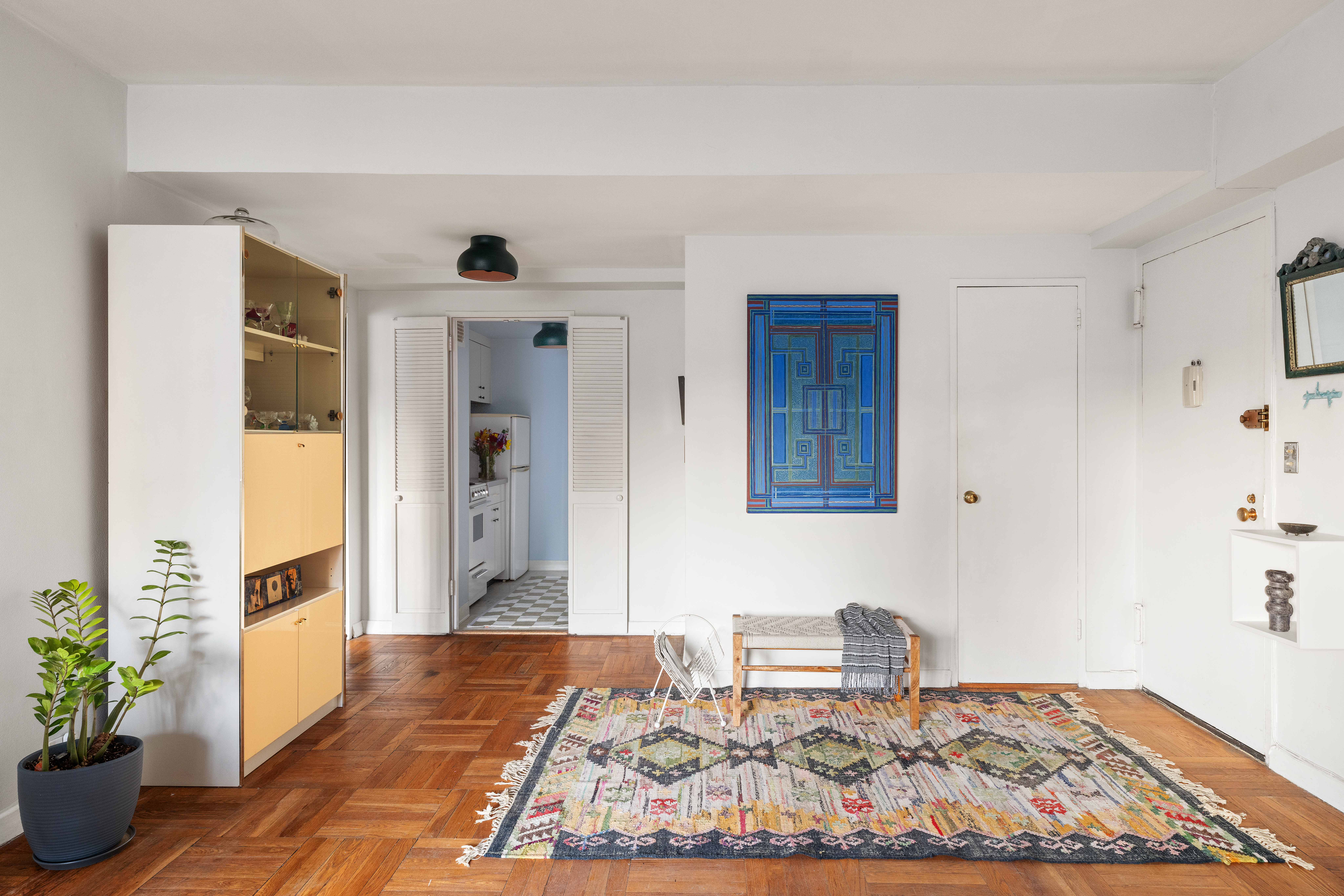 10 East End Avenue, Unit 18E Manhattan, NY 10075 - Photo 4 of 13 a living room with furniture and a rug