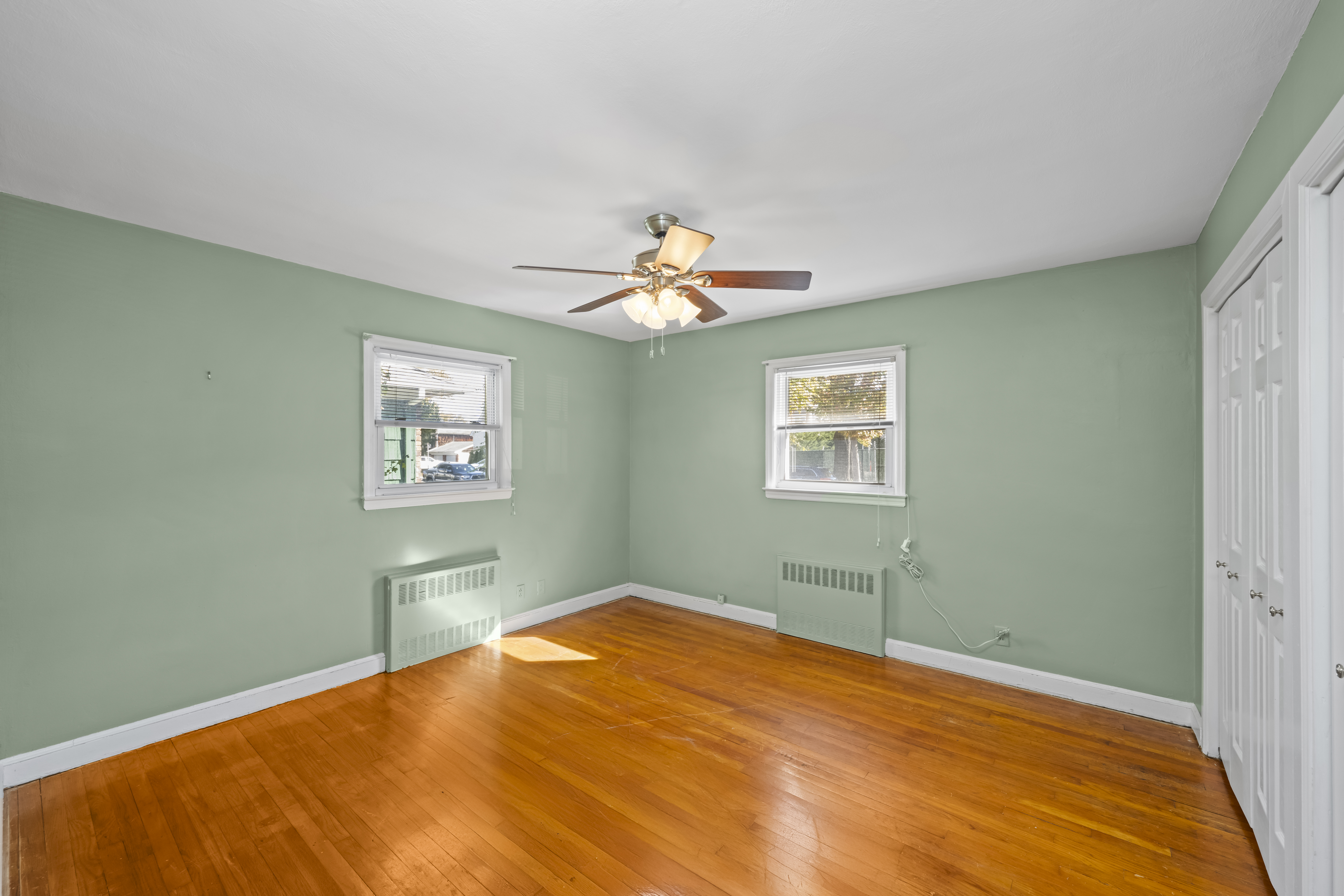 522 Stewart Avenue Staten Island, NY 10314 - Photo 16 of 33 a bedroom with a bed and a window